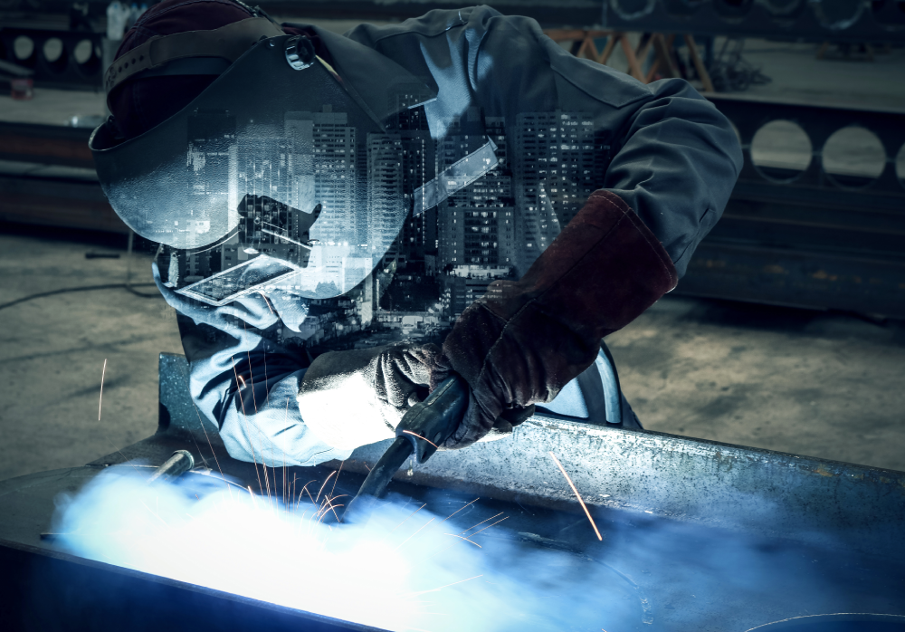 A welder working in a factory, sparks flying, with a city skyline overlayed on the image, symbolizing industrial progress